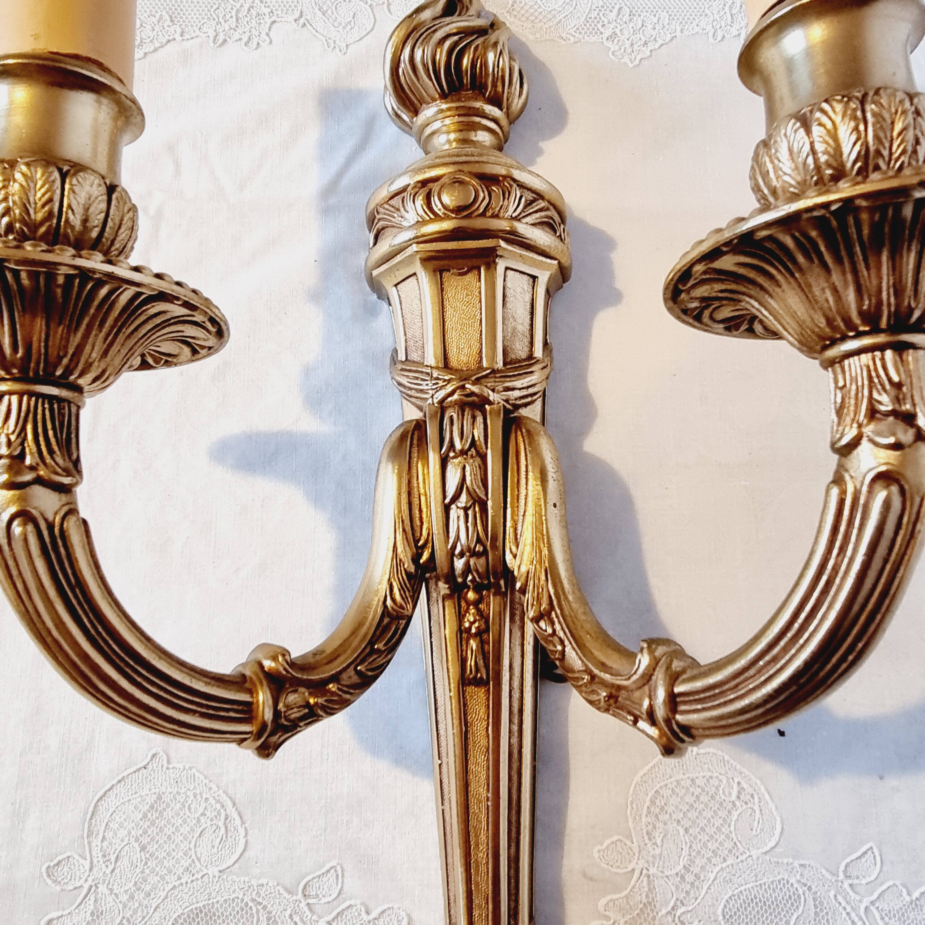 Pair of Louis XV style rocaille two-armed sconces in gilded bronze