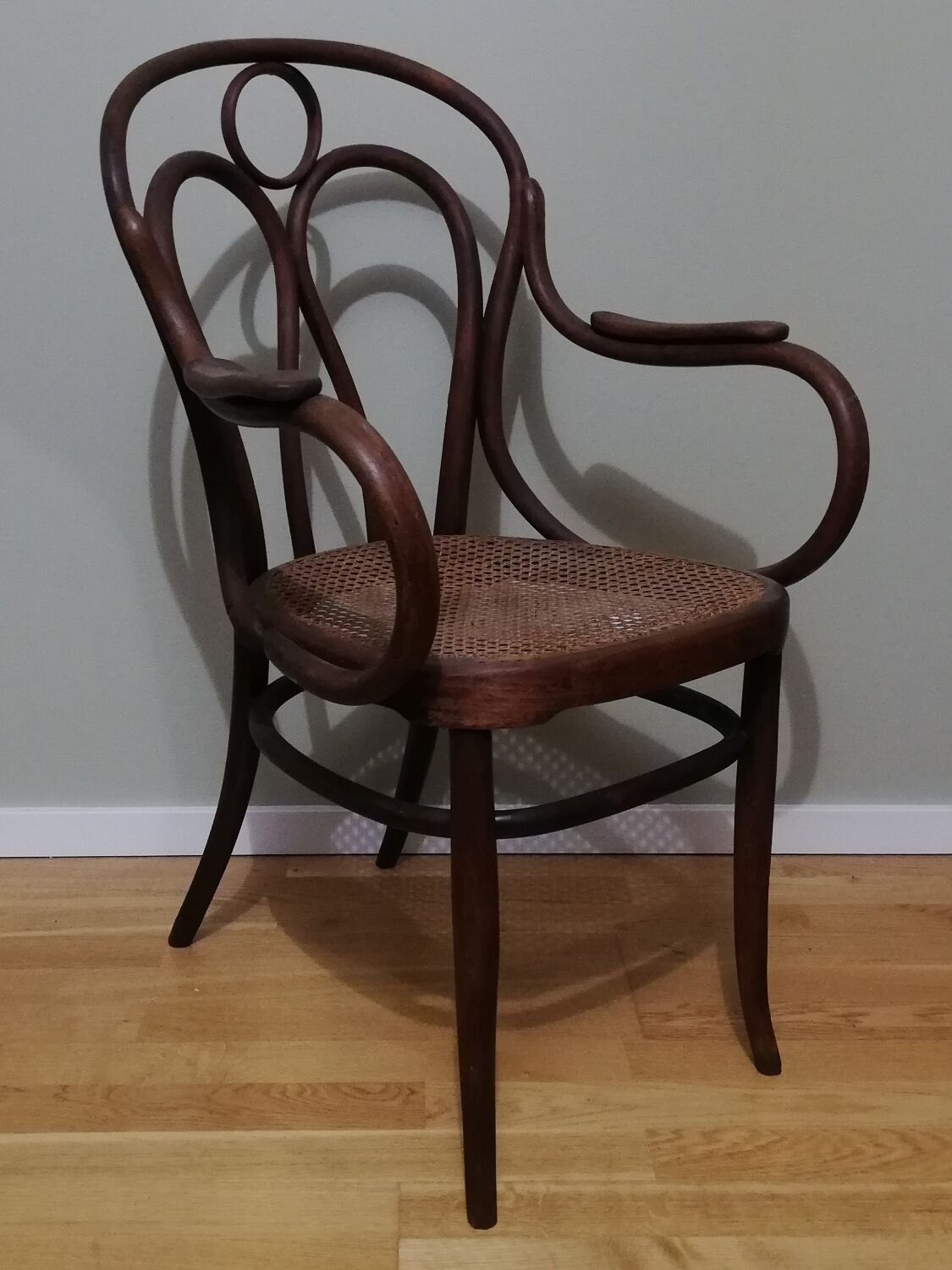 Canned armchair in curved wood signed J.Kohn