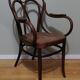 Canned armchair in curved wood signed J.Kohn