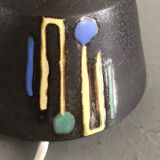 Brutalist style laying lamp with rope lampshade and ceramic foot