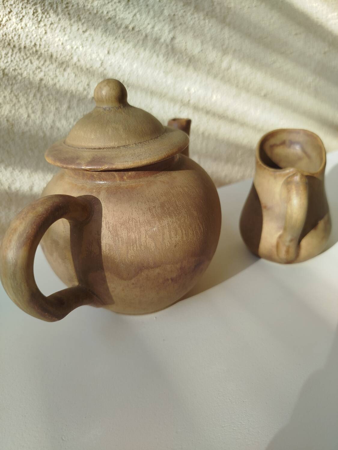 Teapot and small earthenware pot