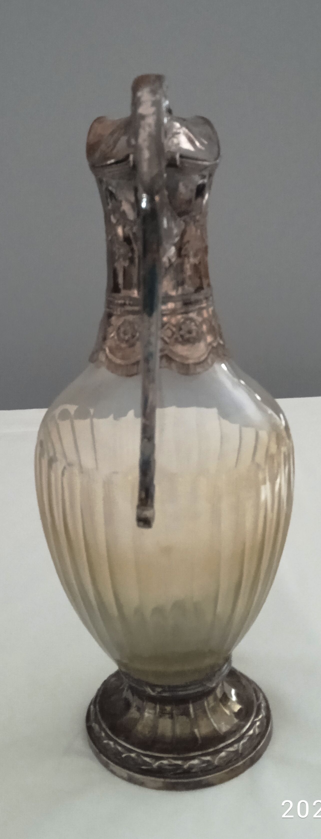 Glass and silver metal ewer