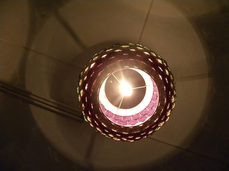 Handmade suspension in coloured woven natural plant fibres.