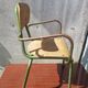 Former green metal child chair