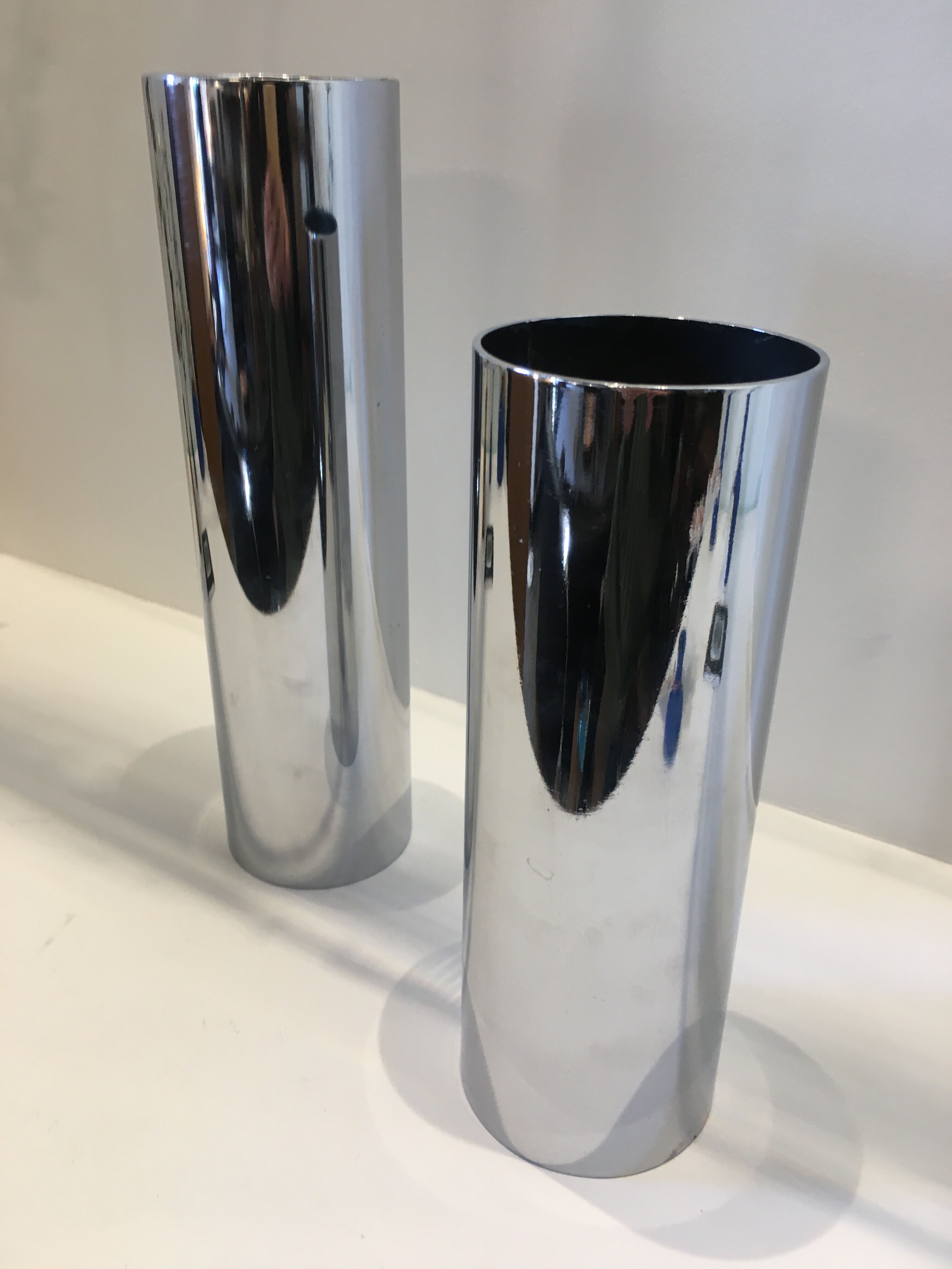Pair of silver metal tube vases