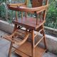 Chaise haute en bois pour bébé vintage