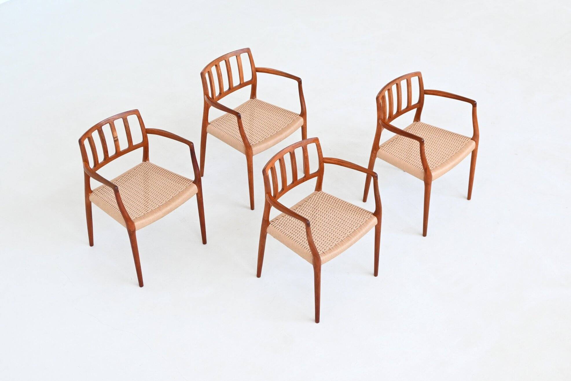Niels Otto Moller model 66 armchairs teak and paper cord Denmark 1974