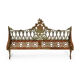 Sculpted cast iron bench with green patina