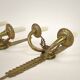 Pair of two-armed Empire wall sconces in gilded bronze