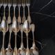 24 silver-plated metal table settings in the filet model.