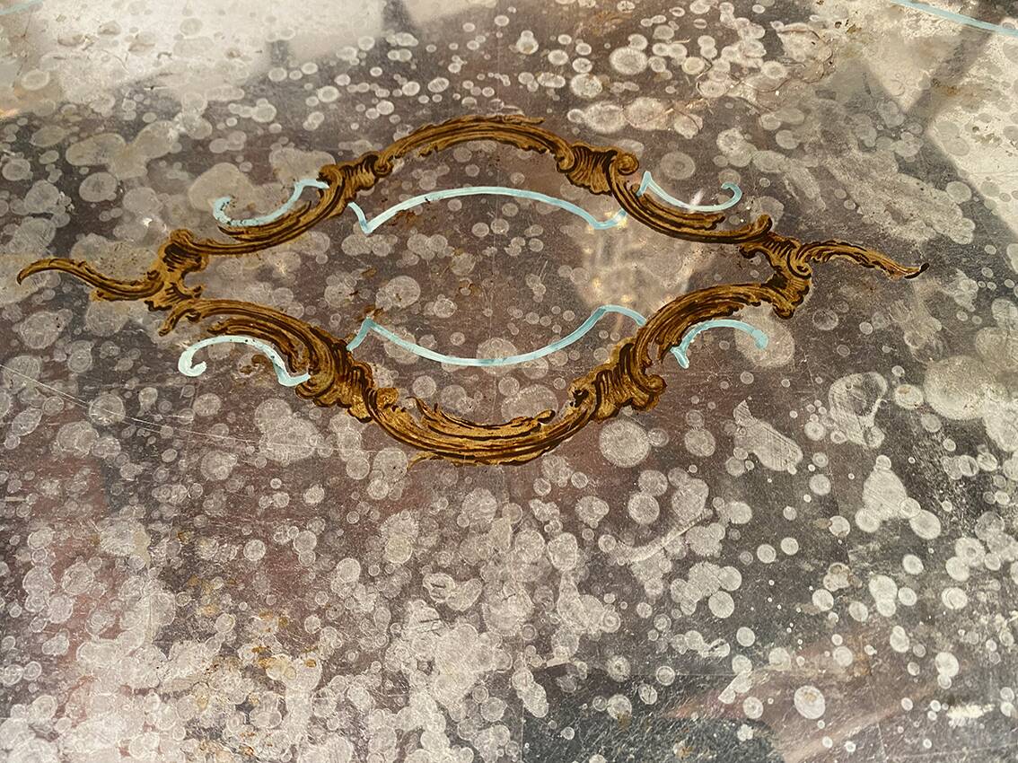 Louis XV style coffee table in carved wood with grey and gold highlights.