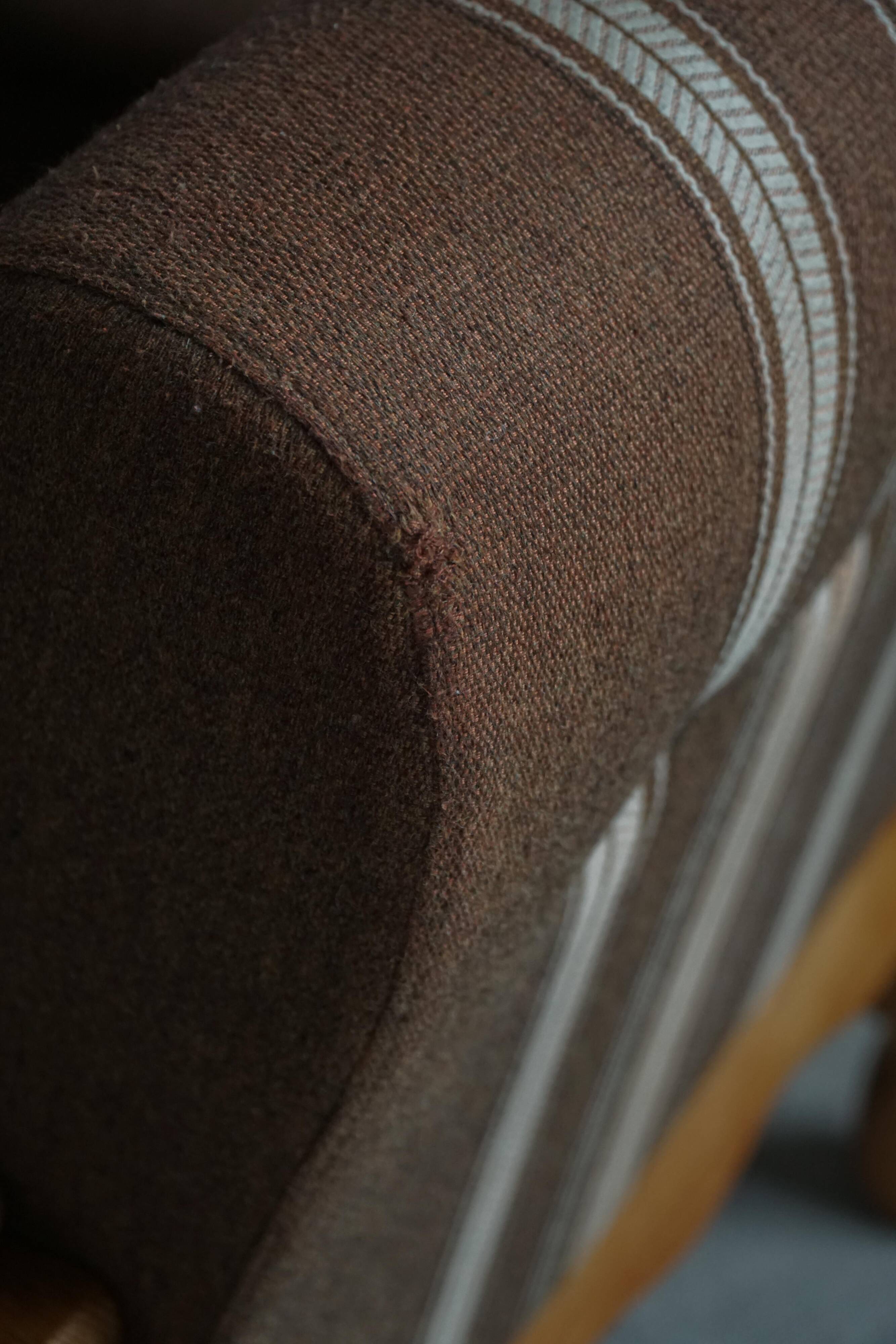 Modern Danish, a pair of lounge chairs in oak and wool, Henning Kjærnulf, 1960s.