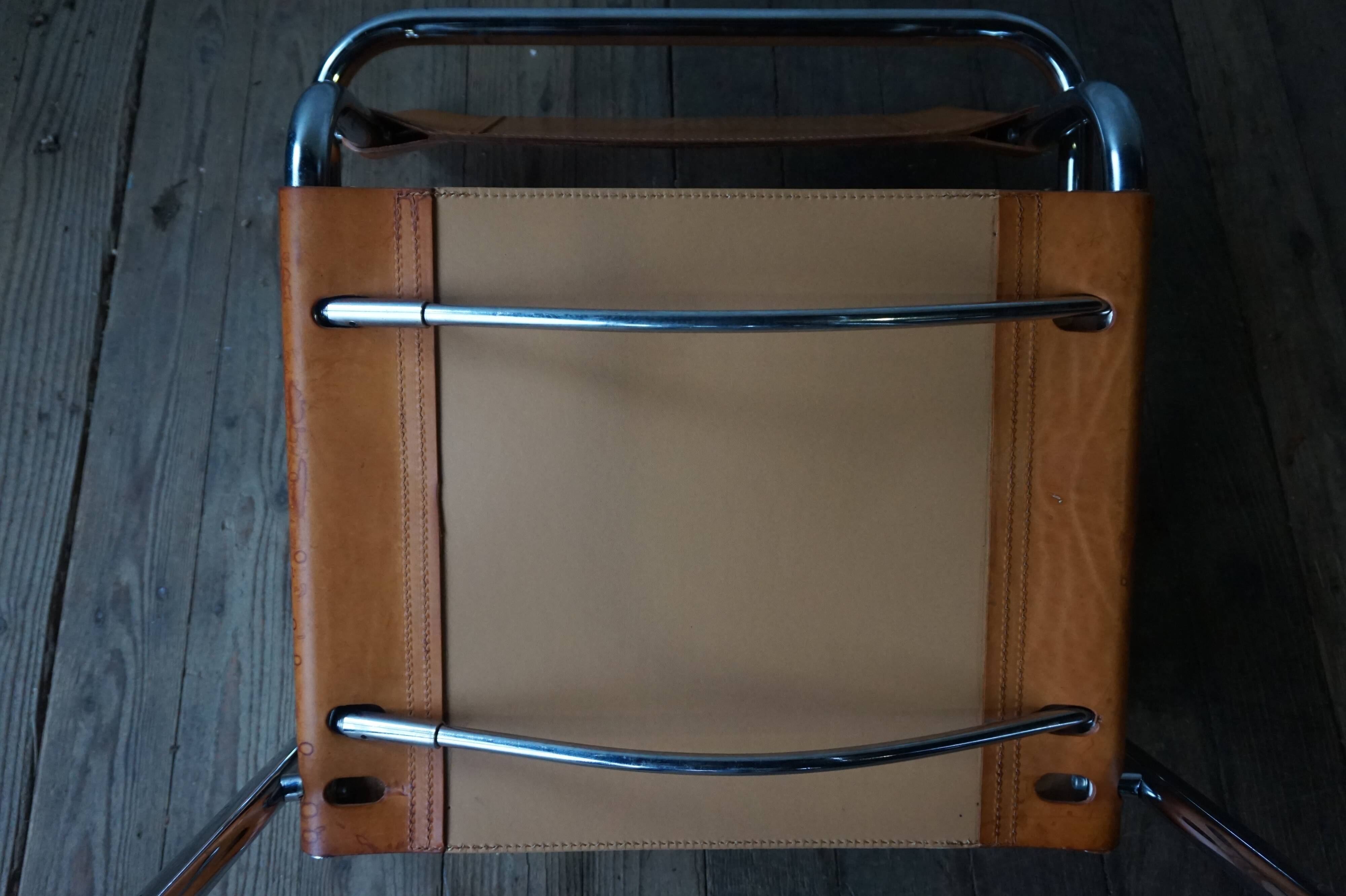 Three  leather armchairs