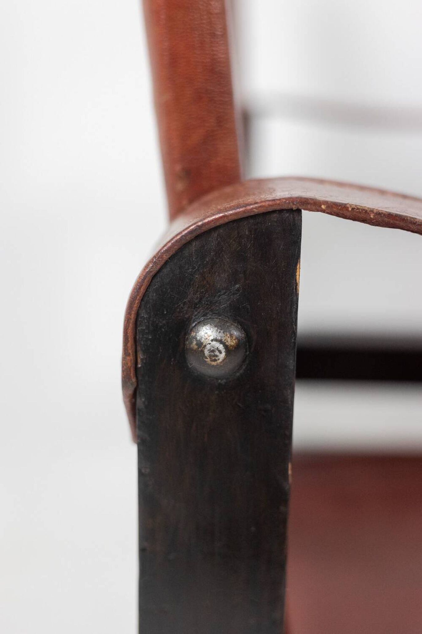“Safari” armchair in wood and cognac leather. 1960s/70s.