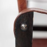 “Safari” armchair in wood and cognac leather. 1960s/70s.