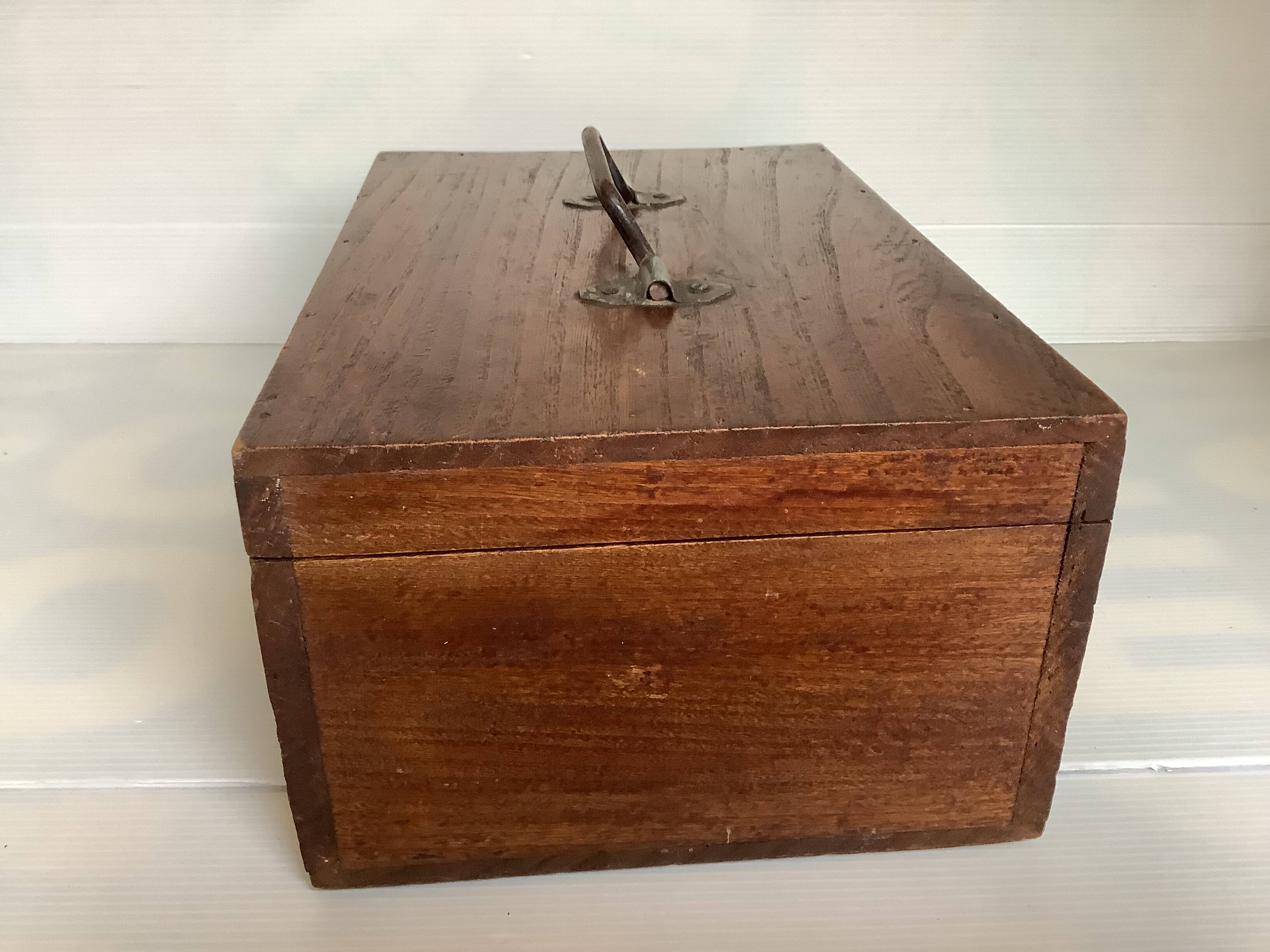 Old wooden box with handle