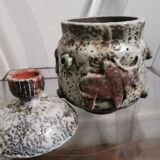 Ceramic pot decorated with bulls in relief