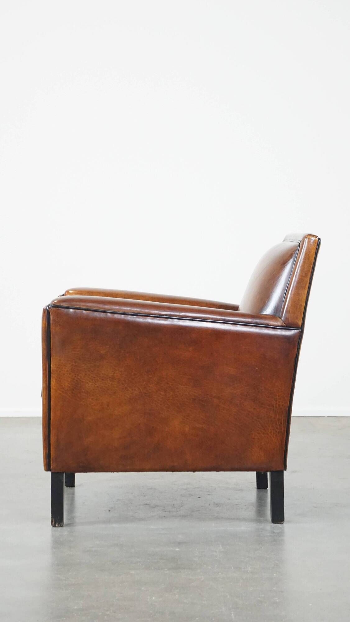 Cognac-colored sheep leather Art Deco design armchair finished with piping