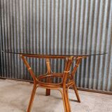 Round rattan table with glass