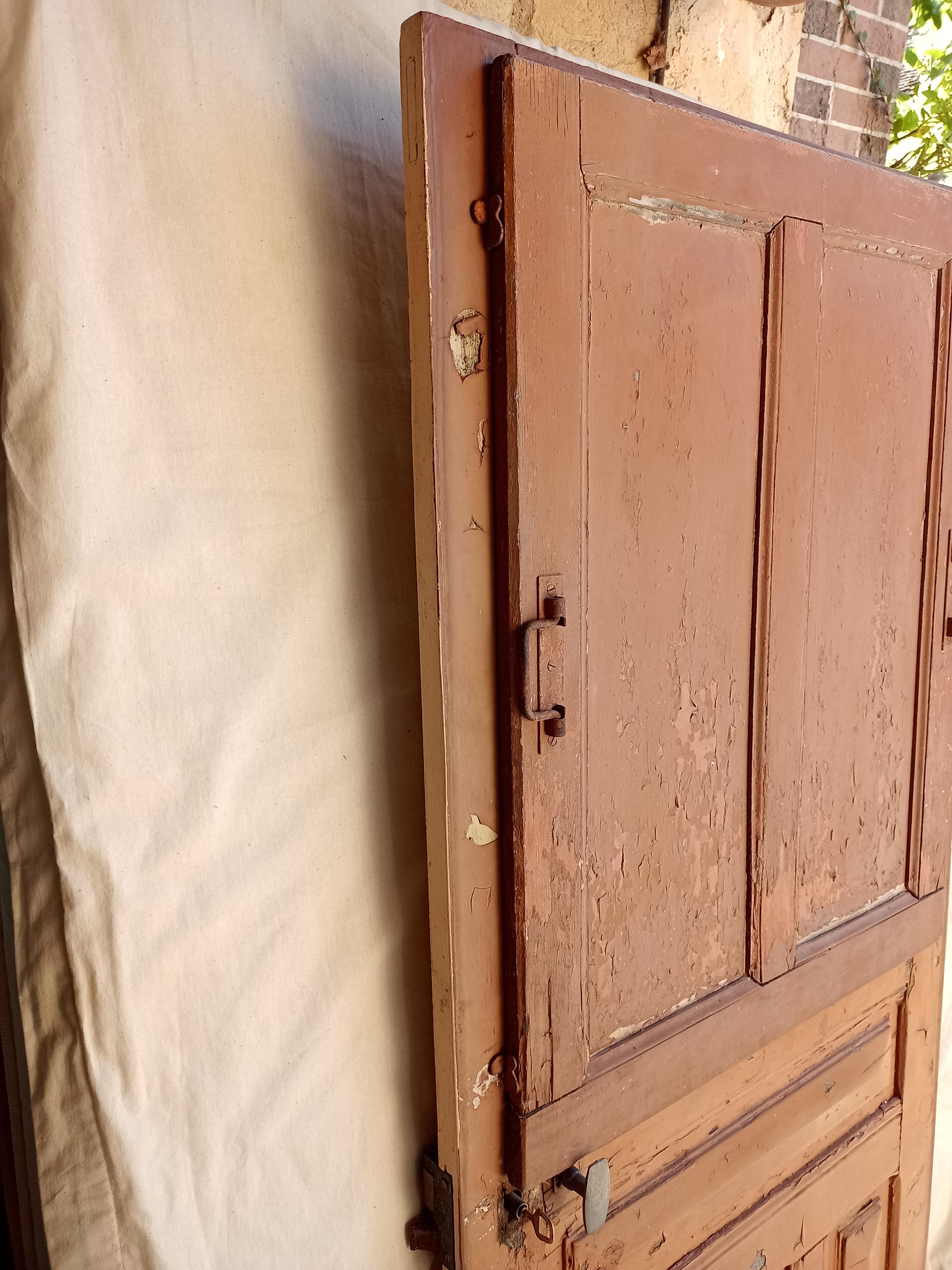 Old glazed door with its shutter