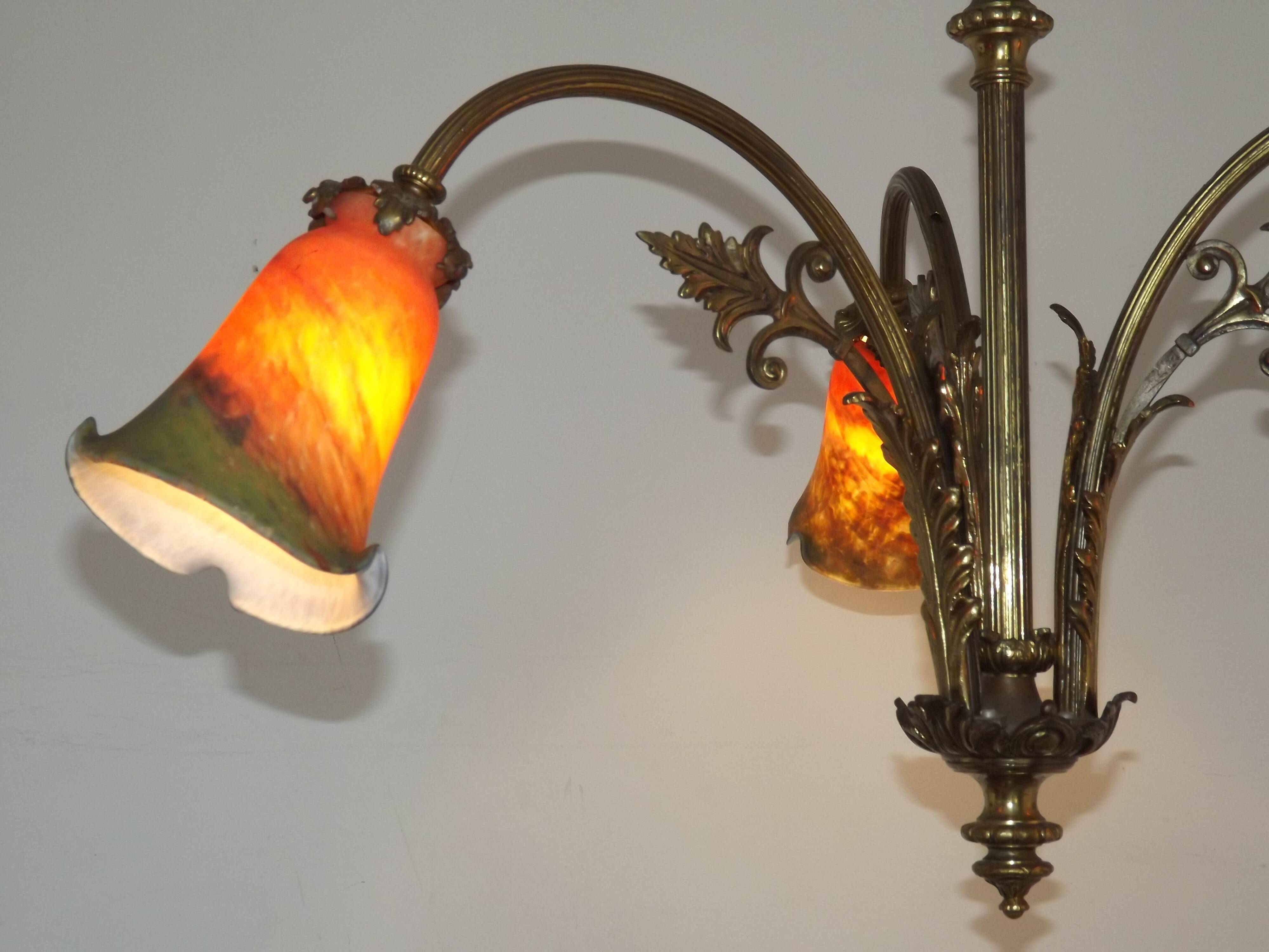 Art Nouveau three-light chandelier in bronze with orange and green glass shade, France.