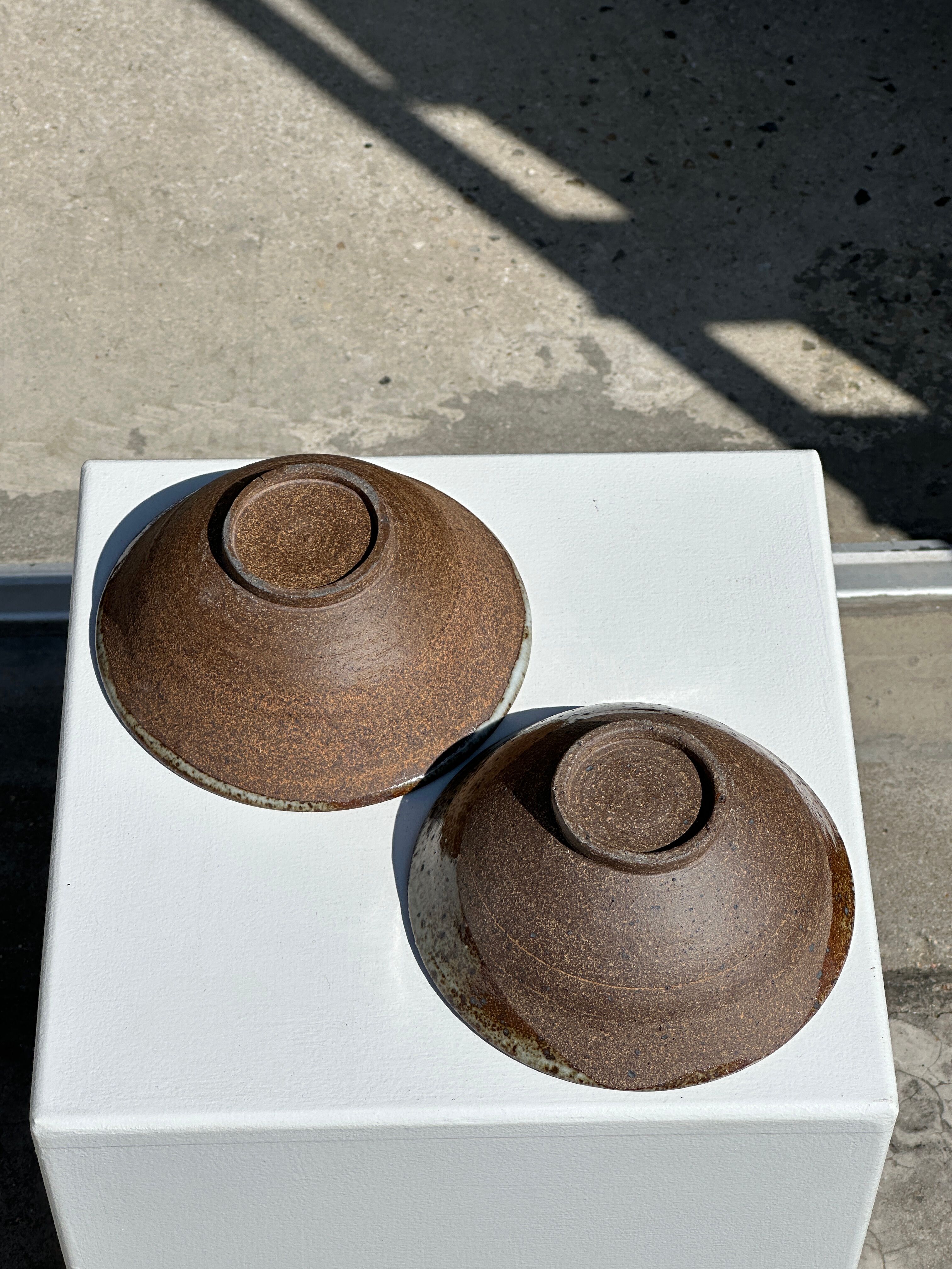 Duo of ceramic bowls interior glazed exterior matt raw earth