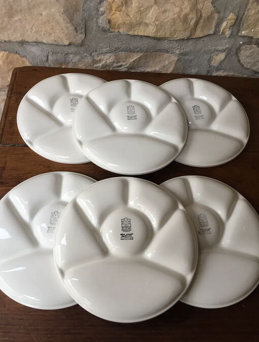 Six fondue plates by Gien