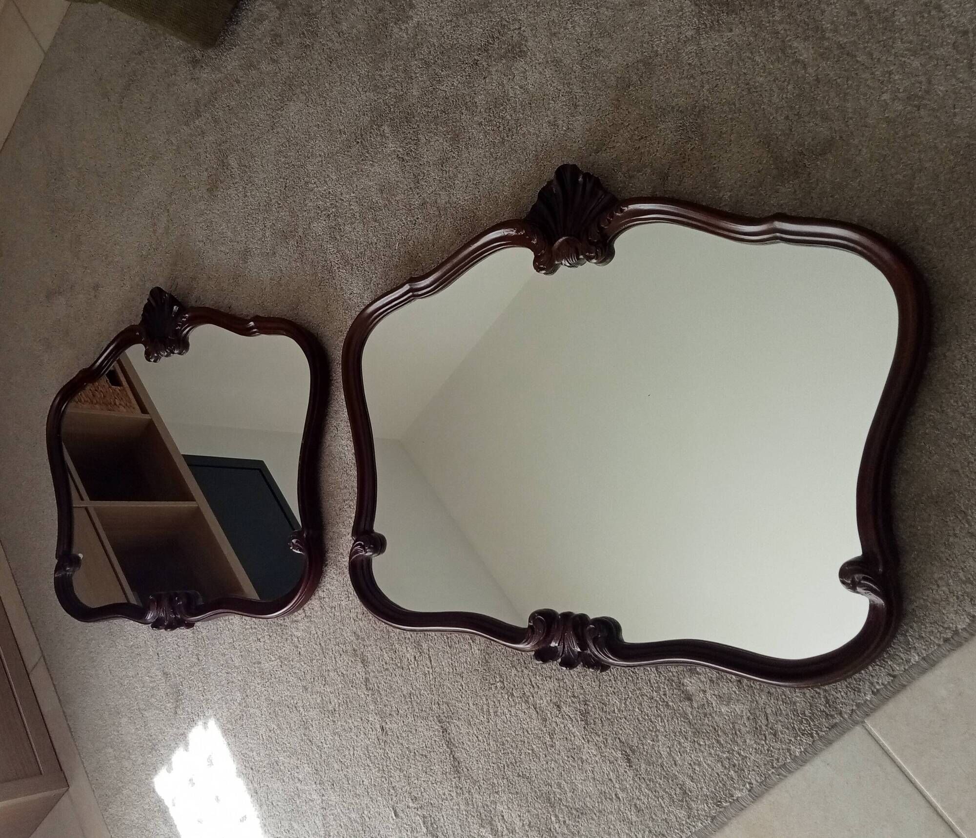 Pair of large antique Rococo style Louis XV mirrors in carved solid wood.