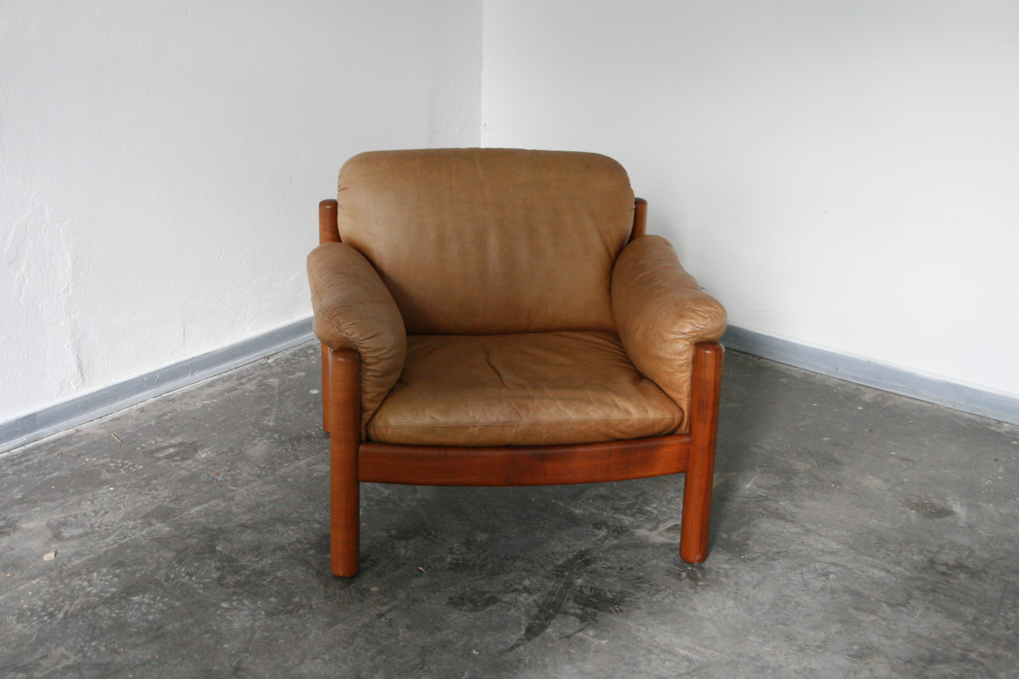 Teak and leather club armchairs