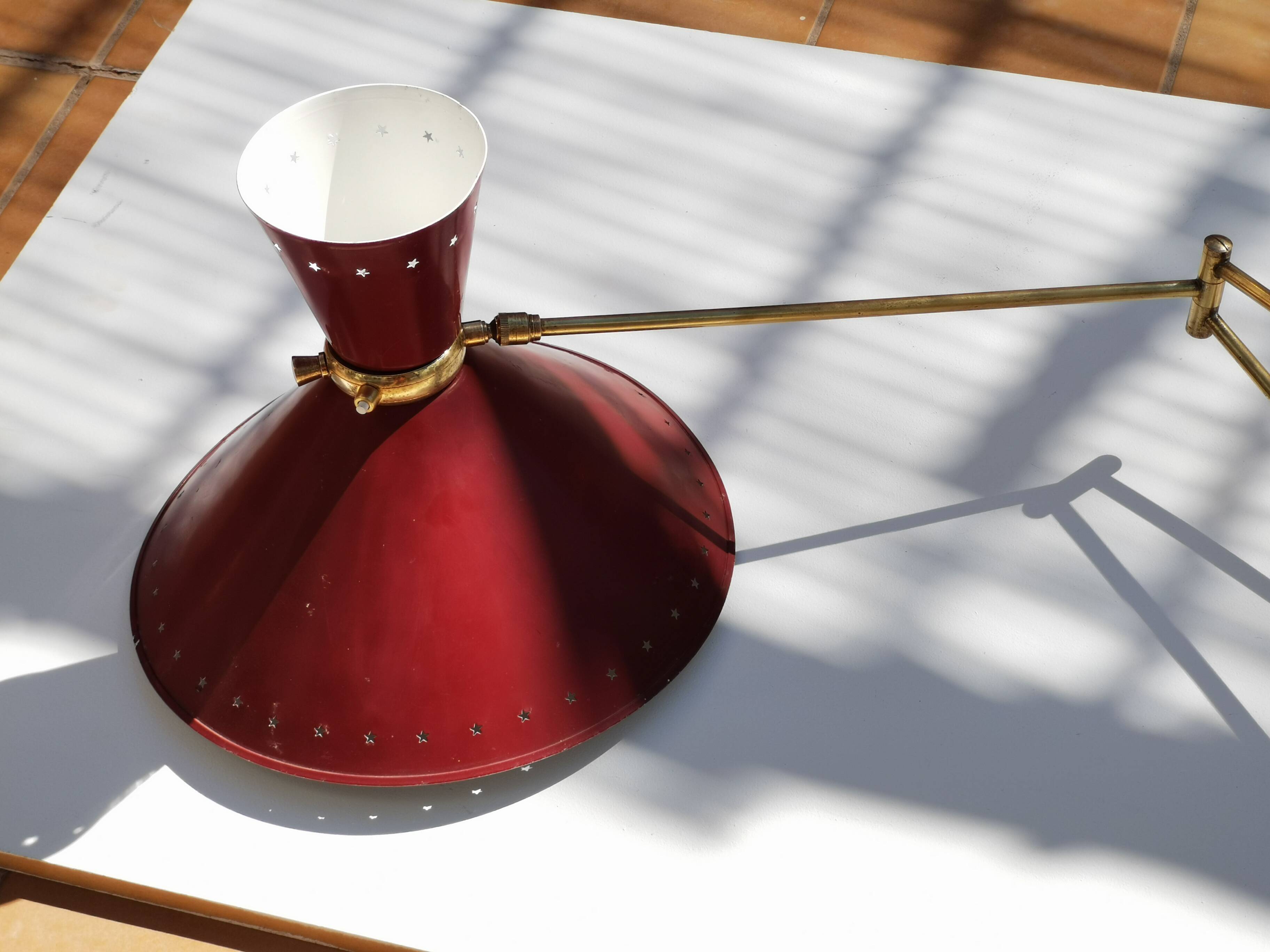 Large Diabolo wall lamp René Mathieu for Lunel burgundy color