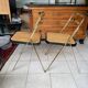 2 ribbed folding chairs CIDUE in gold chrome