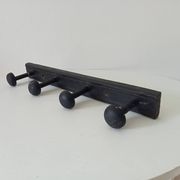 Old wooden wall coat rack