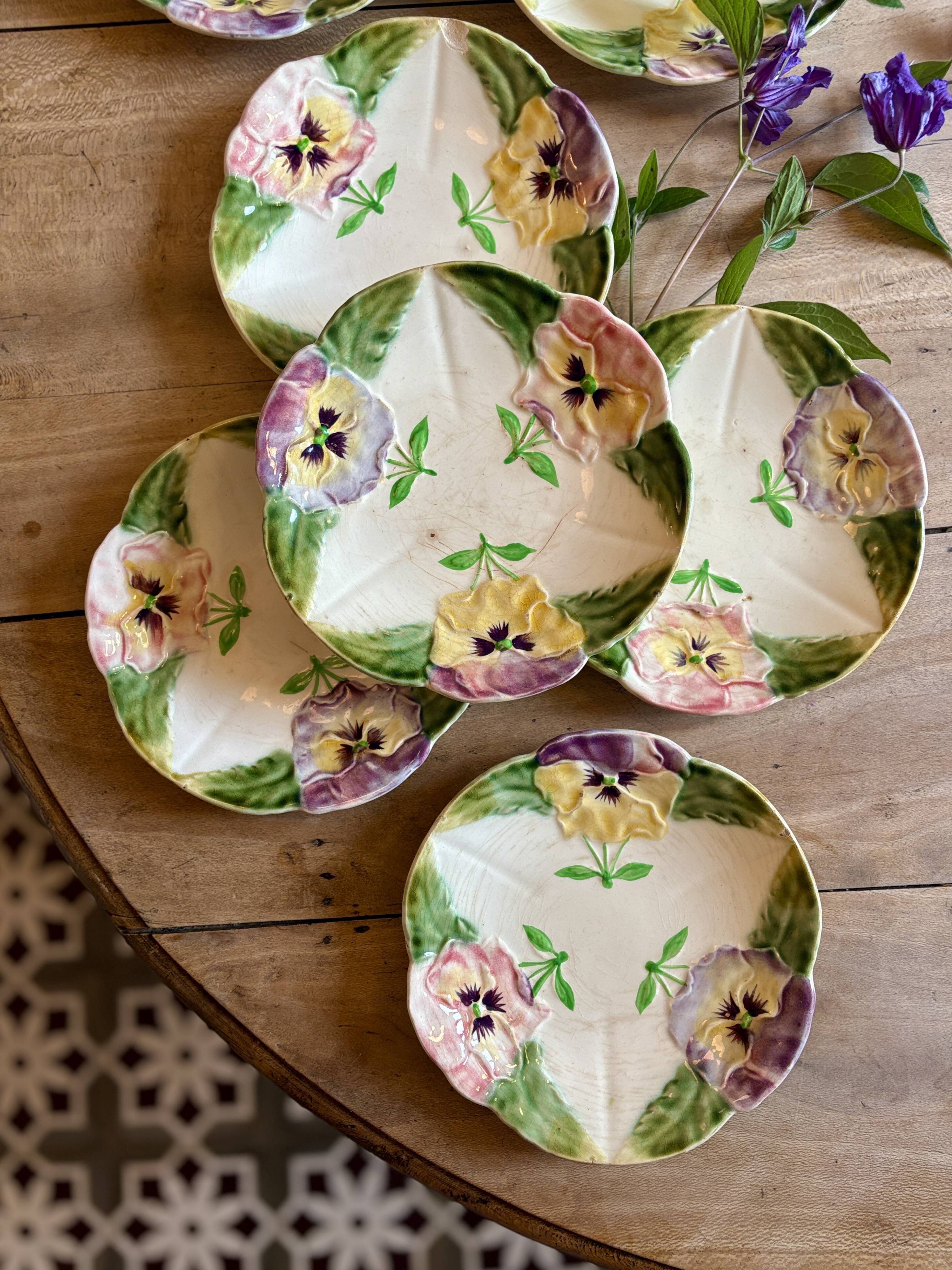 Set of 10 antique slip plates with flower decorations