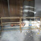 Console in gilded metal and glass