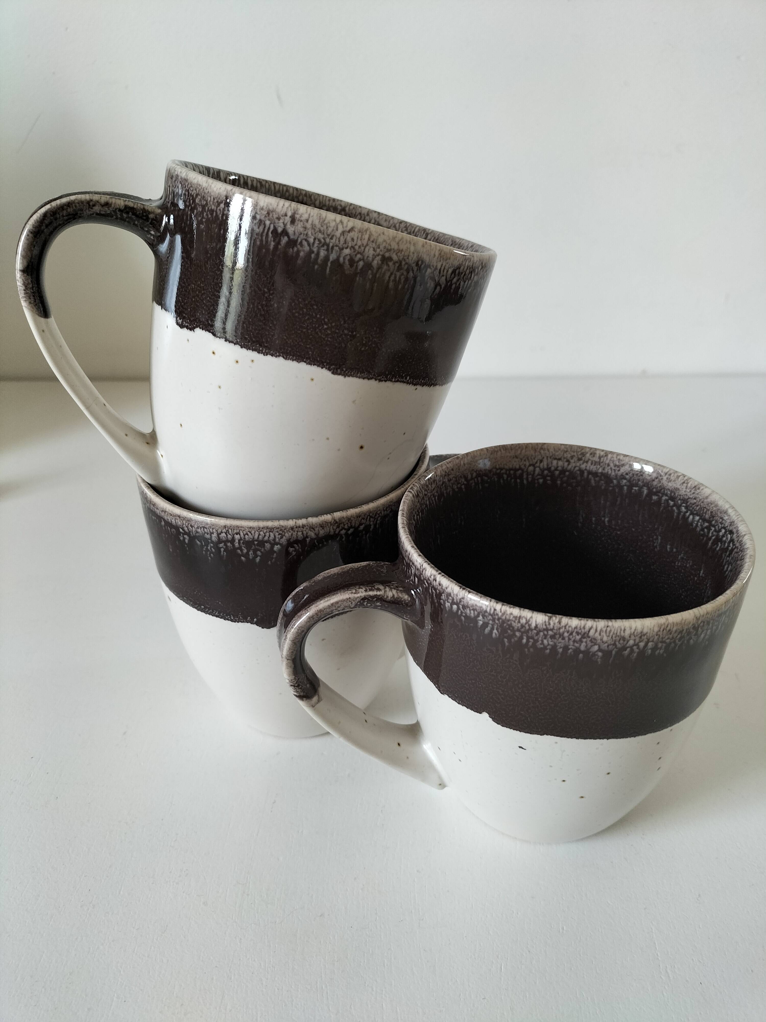 Set of three two-tone mugs, glazed stoneware, café workshop style.