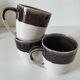 Set of three two-tone mugs, glazed stoneware, café workshop style.