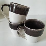 Set of three two-tone mugs, glazed stoneware, café workshop style.