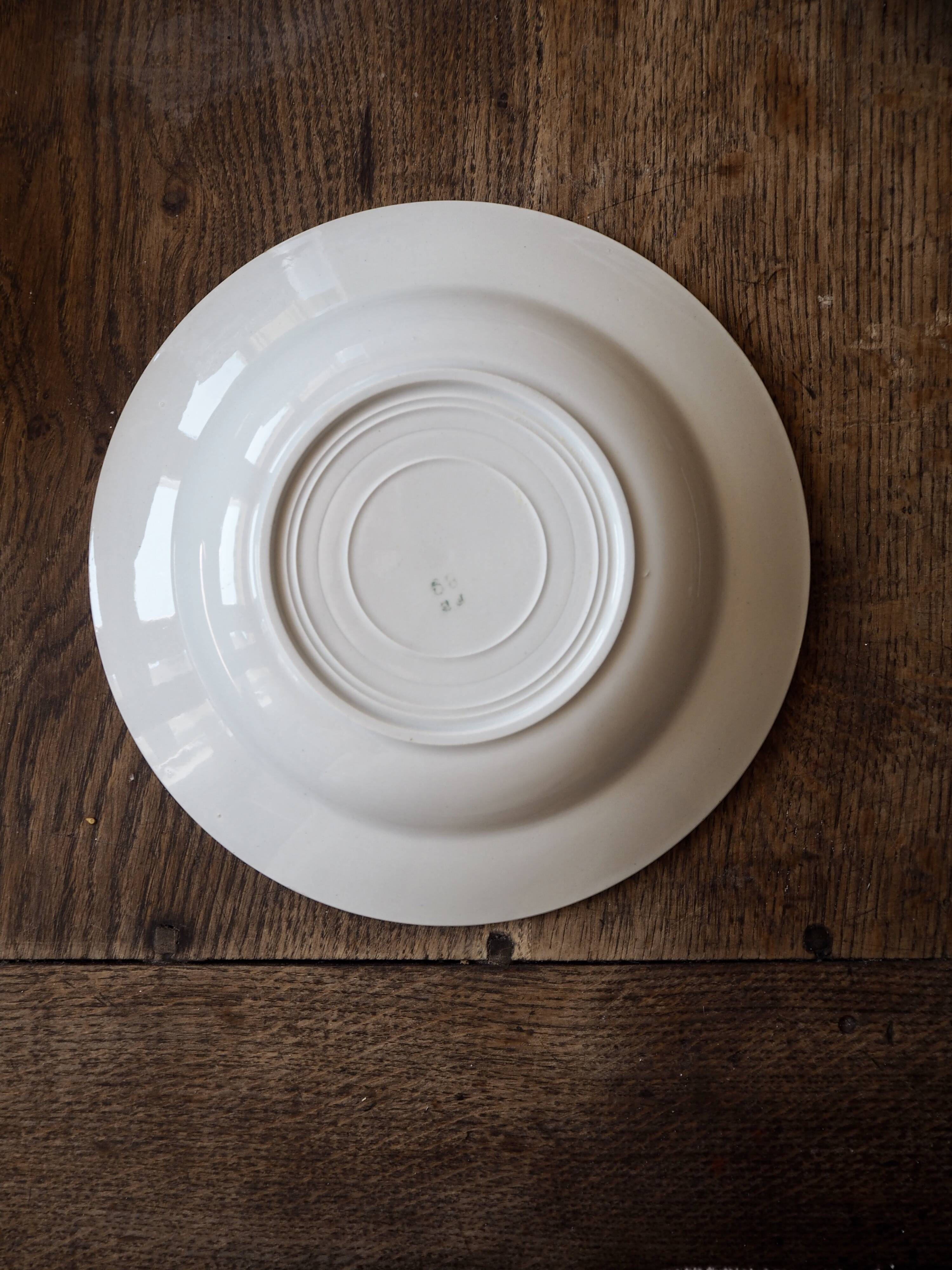 Set of 12 green patterned soup plates, Badonviller earthenware