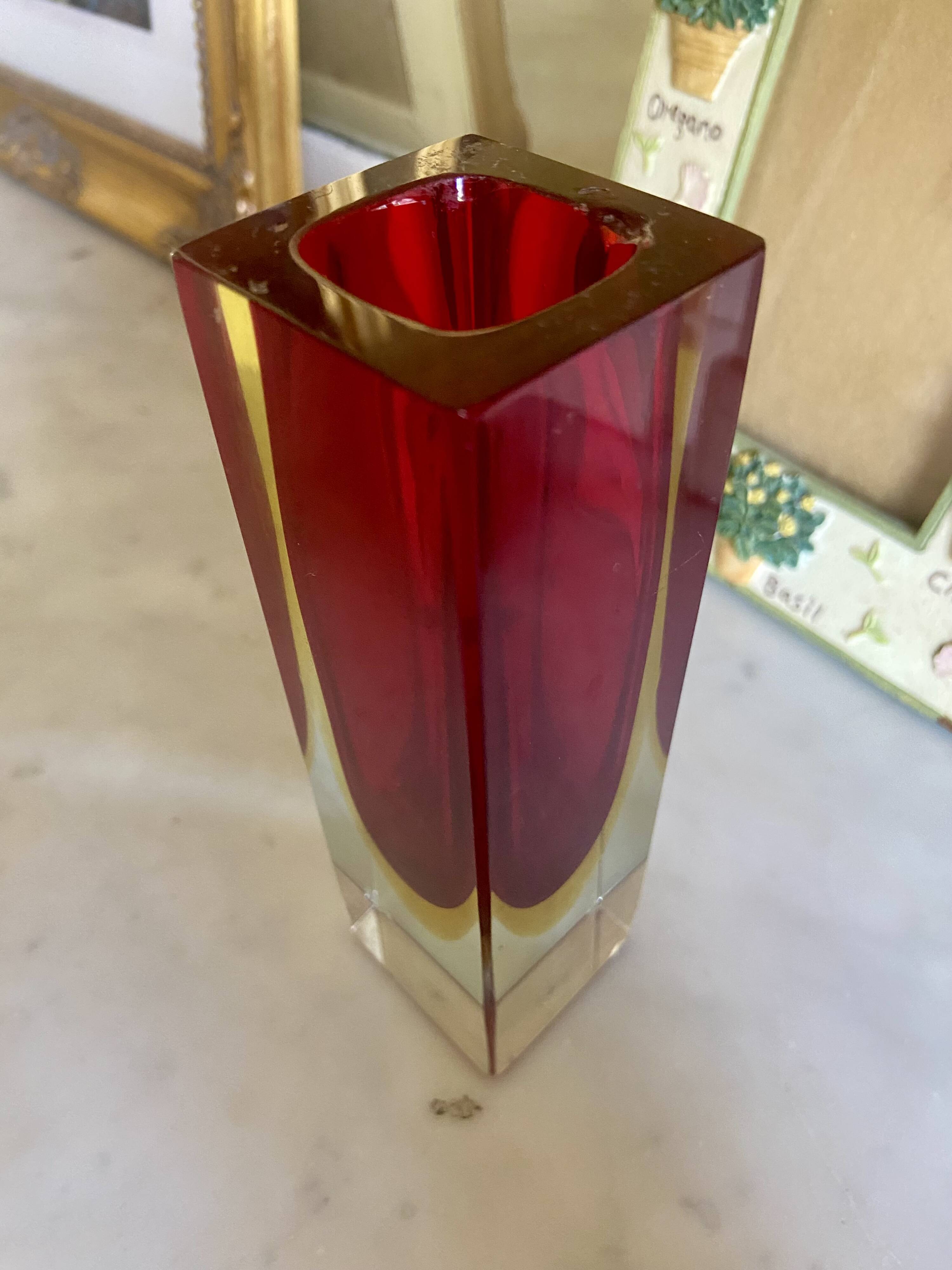 Small red vase made of Murano glass.