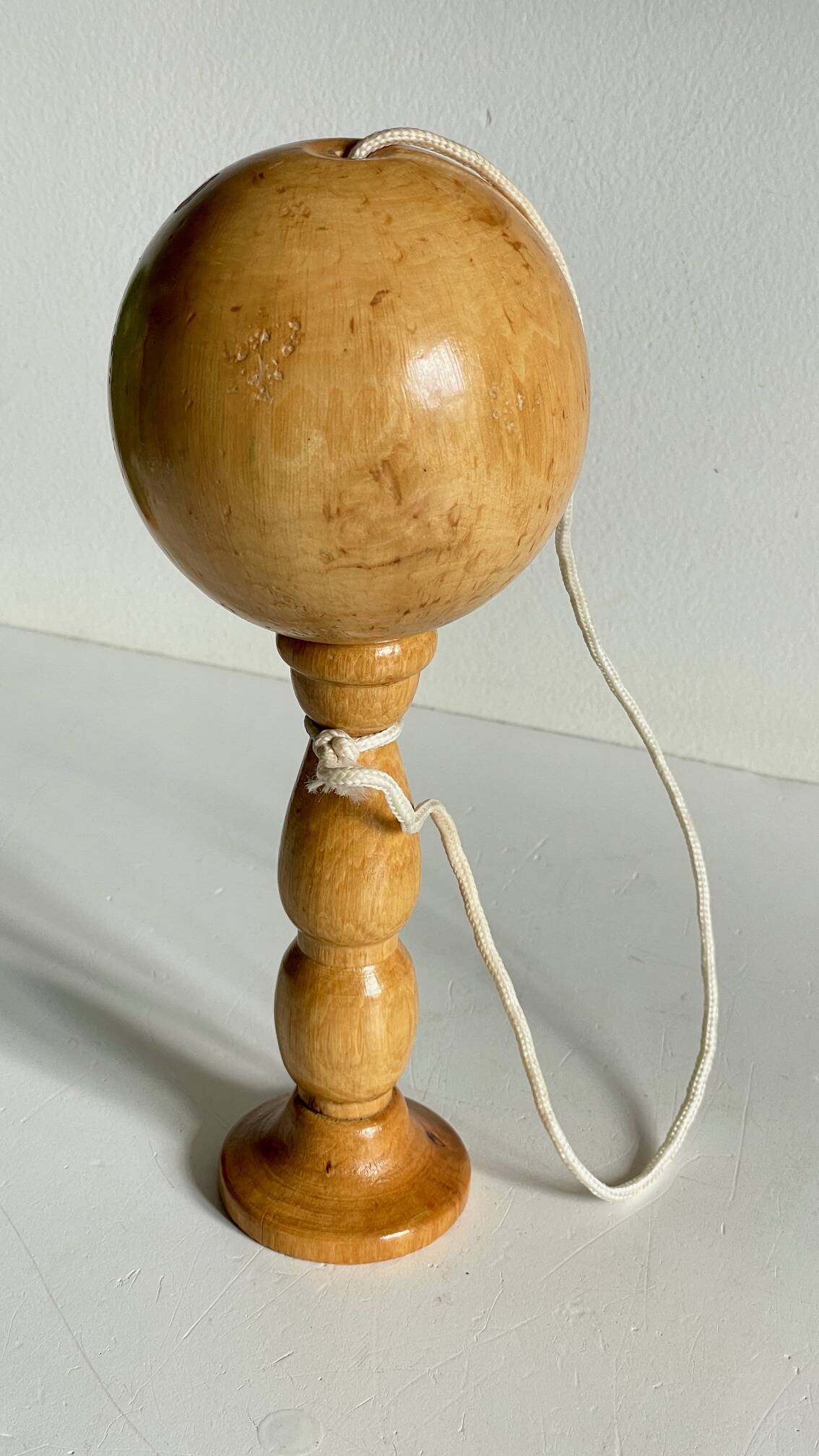 Vintage wooden cup-and-ball toy