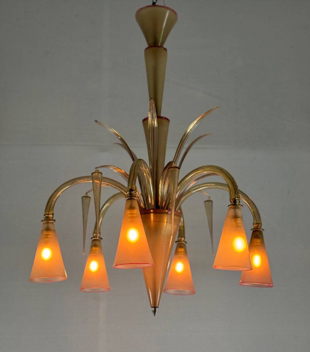 Venetian chandelier in beige/gray murano glass bordered with a red net