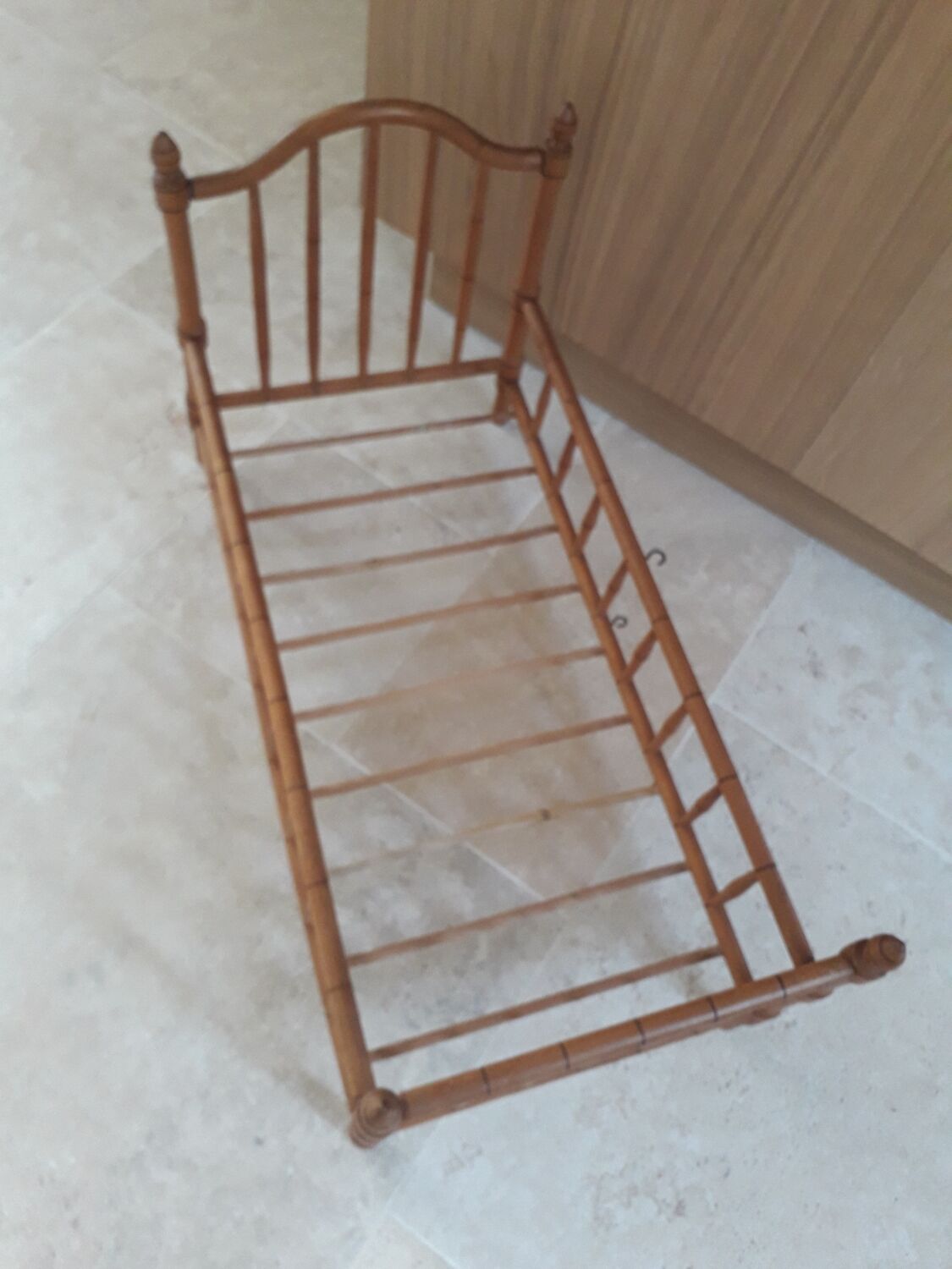 Old wooden doll's bed