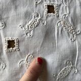 Former embroidered doily