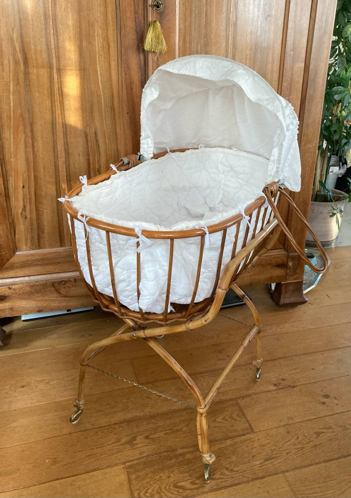 Bamboo, rattan, wicker cradle bassinet from the 1960s with a foldable support.
