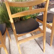 3 Scandinavian style chairs, light wood and black faux leather.