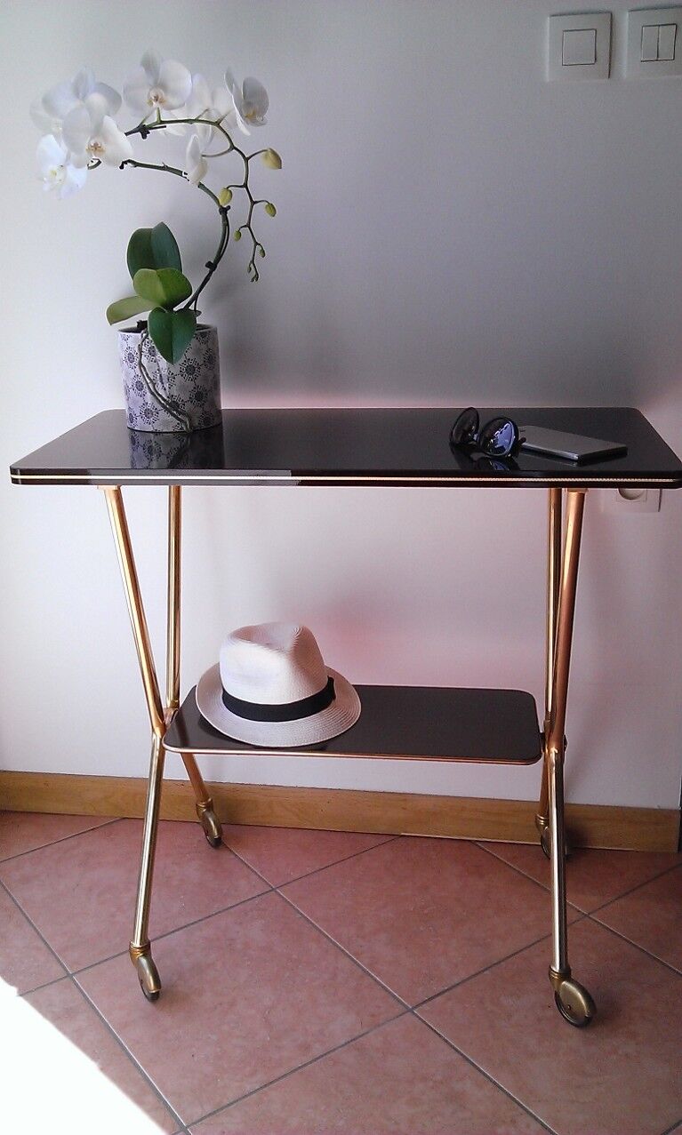 cosole serves feet X brass and chocolate