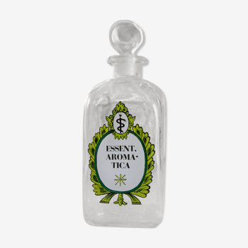 Old pharmacy bottle with Essent inscription cap. Aromatica