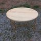 Round neoclassical coffee table with a marble top and golden metal base.
