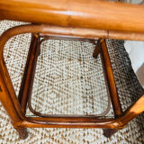 Two rattan and glass bedside tables