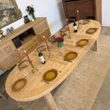 Oval farmhouse table in solid oak with extensions.